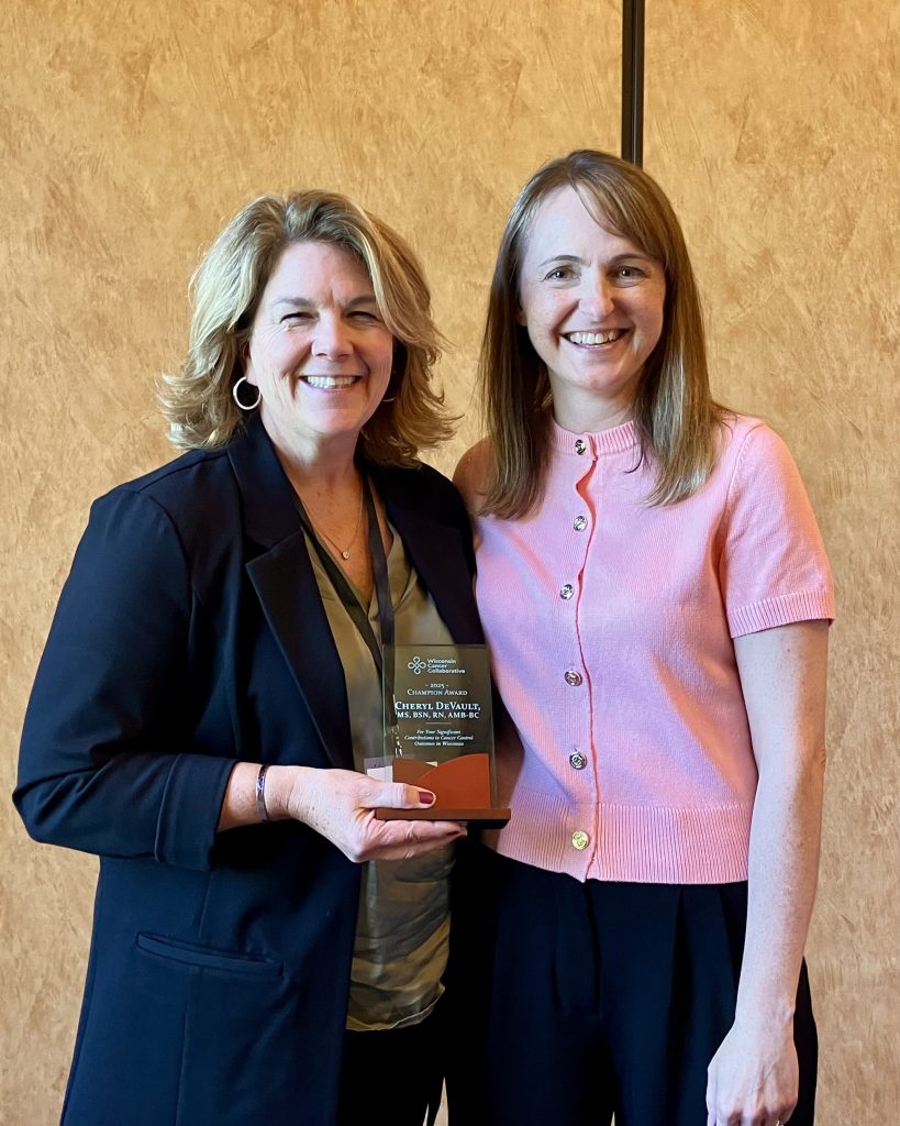 Cheryl DeVault, Primary Care Program Manager at Rural Wisconsin Health Cooperative, receiving the 2025 Champion Award